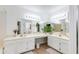 Large bathroom with double sinks, vanity, and a large mirror with bright lighting at 4772 W Joshua Blvd, Chandler, AZ 85226