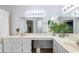 Bright bathroom featuring double sinks, a vanity, and a large mirror with bright lights at 4772 W Joshua Blvd, Chandler, AZ 85226