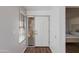 Bright home entryway featuring a secure storm door and light gray walls, leading to an inviting interior at 4772 W Joshua Blvd, Chandler, AZ 85226
