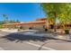 Attractive single-Gathering home with a tile roof, three-car garage, and a lush, well-maintained front yard at 4772 W Joshua Blvd, Chandler, AZ 85226