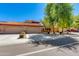 Appealing single-story house showcases a three-car garage, desert landscaping, and a classic Southwestern style at 4772 W Joshua Blvd, Chandler, AZ 85226