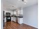 Efficient kitchen features white cabinets and black appliances with plenty of counter space at 4772 W Joshua Blvd, Chandler, AZ 85226