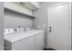 Functional laundry room equipped with a washer, dryer, and overhead shelving for optimal organization and storage at 4772 W Joshua Blvd, Chandler, AZ 85226