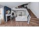Bright living room with fireplace, staircase to the second floor, and high ceilings at 4772 W Joshua Blvd, Chandler, AZ 85226