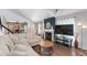 Bright living room boasts vaulted ceilings, fireplace, modern decor, and an open floor plan for comfortable living at 4772 W Joshua Blvd, Chandler, AZ 85226