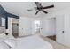 Bright main bedroom featuring a ceiling fan and ensuite bathroom; close to a walk-in closet at 4772 W Joshua Blvd, Chandler, AZ 85226
