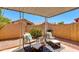 Inviting outdoor patio featuring comfortable seating, lush greenery, and a BBQ grill for entertaining guests at 4772 W Joshua Blvd, Chandler, AZ 85226