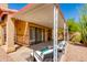 Covered patio space with comfortable seating, perfect for outdoor relaxation and enjoying the surrounding landscape at 4772 W Joshua Blvd, Chandler, AZ 85226