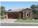 Charming single-story home featuring a stone facade, two-car garage, and well-maintained landscaping at 4787 E French Rd, San Tan Valley, AZ 85143