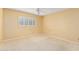 Bedroom with neutral walls, white plantation shutters, and carpet flooring at 507 W Sweetwater Ave, Phoenix, AZ 85029