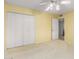 Bedroom with white closet doors and carpet flooring at 507 W Sweetwater Ave, Phoenix, AZ 85029
