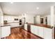 Spacious kitchen with stainless steel appliances, white cabinets, wooden counters and flooring at 507 W Sweetwater Ave, Phoenix, AZ 85029