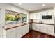 Kitchen featuring white cabinets, stainless steel appliances, wooden counters and an outdoor view to the pool at 507 W Sweetwater Ave, Phoenix, AZ 85029