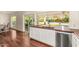 Kitchen boasts a stainless steel dishwasher, wooden countertop, white cabinets, and an outdoor view at 507 W Sweetwater Ave, Phoenix, AZ 85029