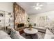 Comfortable living room features a stone fireplace and built-in bookshelves at 507 W Sweetwater Ave, Phoenix, AZ 85029