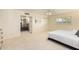 Bright main bedroom with white carpet, a ceiling fan, and an attached bathroom at 507 W Sweetwater Ave, Phoenix, AZ 85029