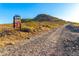 Outdoor trail leading towards a hill, accompanied by signage and desert foliage in a natural setting at 507 W Sweetwater Ave, Phoenix, AZ 85029