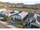 Beautiful aerial shot showcases a well-maintained home with desert landscaping and community views at 5345 W Alta Mesa Ave, Laveen, AZ 85339