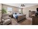 Relaxing bedroom featuring a large bed, stylish furnishings, and plenty of natural light for a serene atmosphere at 5345 W Alta Mesa Ave, Laveen, AZ 85339