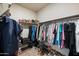 Walk-in closet with organized shelving, hanging space, and shoe storage, maximizing storage capacity and efficiency at 5345 W Alta Mesa Ave, Laveen, AZ 85339