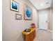 Entryway with a wooden cabinet and artwork that makes an appealing and welcoming space at 5345 W Alta Mesa Ave, Laveen, AZ 85339
