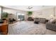 Bright living room with patio access, neutral colors, and carpet at 5345 W Alta Mesa Ave, Laveen, AZ 85339