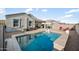 Backyard pool and patio featuring lounge chairs and covered seating, perfect for relaxation at 5345 W Alta Mesa Ave, Laveen, AZ 85339