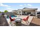 Inviting pool area with comfortable seating and a cozy fire pit, perfect for outdoor relaxation at 5345 W Alta Mesa Ave, Laveen, AZ 85339
