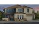 Charming two-story home with stone accents, a two-car garage, and well manicured landscaping at 5917 N 83Rd Ln, Glendale, AZ 85305