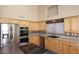 Updated kitchen featuring stainless steel appliances and ample counter space at 6023 E Scafell Cir, Mesa, AZ 85215