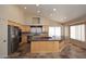 Bright, open kitchen with stainless steel appliances and a large center island at 6023 E Scafell Cir, Mesa, AZ 85215