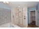 Luxurious main bathroom featuring soaking tub with tile surround and walk-in shower with seating at 6023 E Scafell Cir, Mesa, AZ 85215