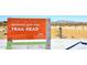 The Mountain Vista Trail Head sign showcases a network of desert trails for outdoor enthusiasts at 6023 E Scafell Cir, Mesa, AZ 85215