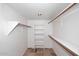 Functional walk-in closet with built-in shelving and rod system for optimal storage at 6023 E Scafell Cir, Mesa, AZ 85215