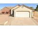 Charming single-story home with a two-car garage and low-maintenance desert landscaping in front at 6320 W Del Mar Ln, Glendale, AZ 85306