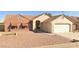 Charming single-story home with a two-car garage and low-maintenance desert landscaping in front at 6320 W Del Mar Ln, Glendale, AZ 85306