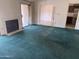Living room with fireplace, sliding doors, and lots of natural light at 6320 W Del Mar Ln, Glendale, AZ 85306