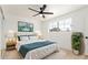 Well-lit bedroom featuring neutral decor, a ceiling fan, and large window at 6813 E Diamond St, Scottsdale, AZ 85257