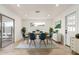 Bright dining room with a modern table and chairs, plus sliding glass doors to the outdoor patio at 6813 E Diamond St, Scottsdale, AZ 85257