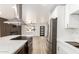 Open-concept kitchen with stainless steel appliances, quartz countertops, and a view into the living area at 6813 E Diamond St, Scottsdale, AZ 85257