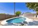 Backyard view of a refreshing private pool area surrounded by desert landscaping and a privacy wall at 6813 E Diamond St, Scottsdale, AZ 85257