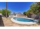 Backyard view featuring a refreshing pool, desert landscaping, and the home's exterior at 6813 E Diamond St, Scottsdale, AZ 85257