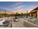 Charming backyard showcasing a pool, spa, fire pit, desert landscaping and outdoor seating with open skies at 7315 E Brisa Dr, Scottsdale, AZ 85266