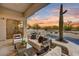 Resort-style backyard with a pool, spa, covered patio, outdoor kitchen, cactus, and desert landscape at 7315 E Brisa Dr, Scottsdale, AZ 85266