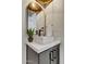 Stylish bathroom vanity with a square sink, modern faucet, and elegant mirror at 7315 E Brisa Dr, Scottsdale, AZ 85266
