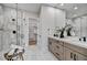 Beautiful bathroom features marble tiling, double vanities and a separate walk-in shower at 7315 E Brisa Dr, Scottsdale, AZ 85266
