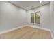 Cozy bedroom with hardwood floors and a window view, perfect for relaxation or office space at 7315 E Brisa Dr, Scottsdale, AZ 85266