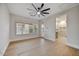 Spacious bedroom with wood floors, plantation shutters, and an en-suite bathroom at 7315 E Brisa Dr, Scottsdale, AZ 85266