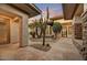 Beautiful courtyard with desert landscaping, stone accents, and a welcoming entrance at 7315 E Brisa Dr, Scottsdale, AZ 85266