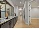 Bright hallway with wood floors, modern finishes, and an open doorway to another room at 7315 E Brisa Dr, Scottsdale, AZ 85266